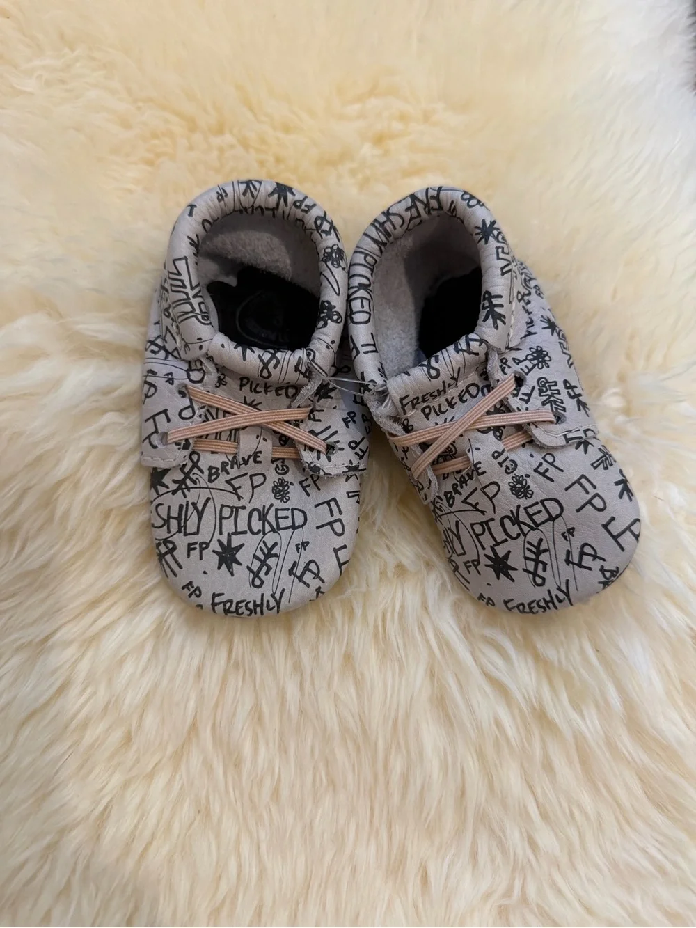 Freshly Picked White with Black Graphic Baby Moccasins